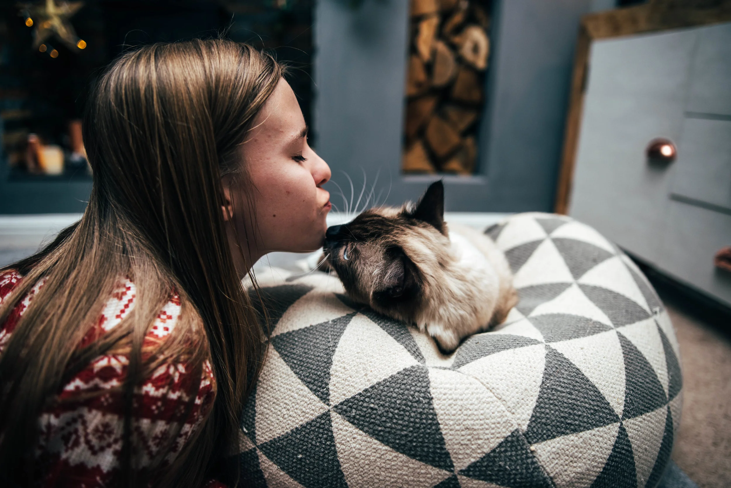 Teen girl kisses ragdoll cat Essex UK Wedding Documentary Photographer