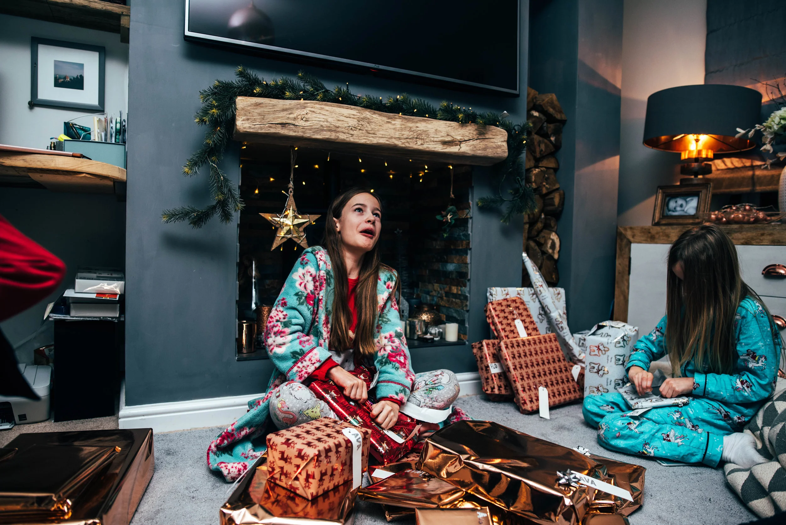 tween girl opens christmas present Essex UK Wedding Documentary Photographer