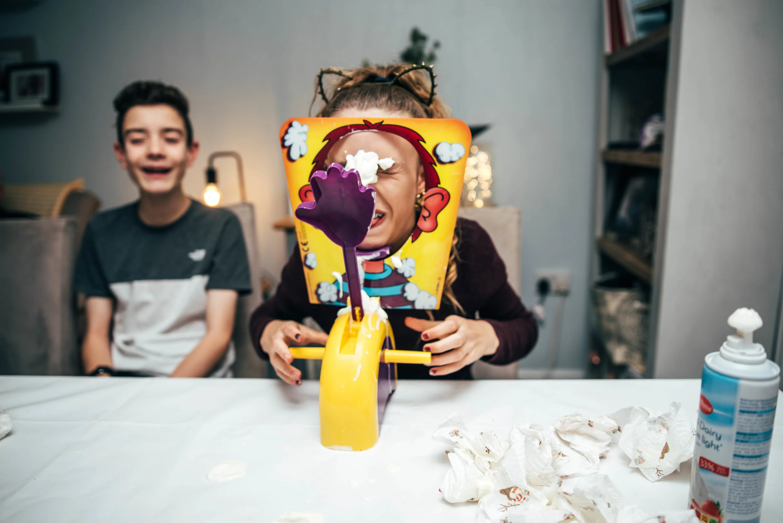 Teen girl plays Pie Face Essex UK Wedding Documentary Photographerw
