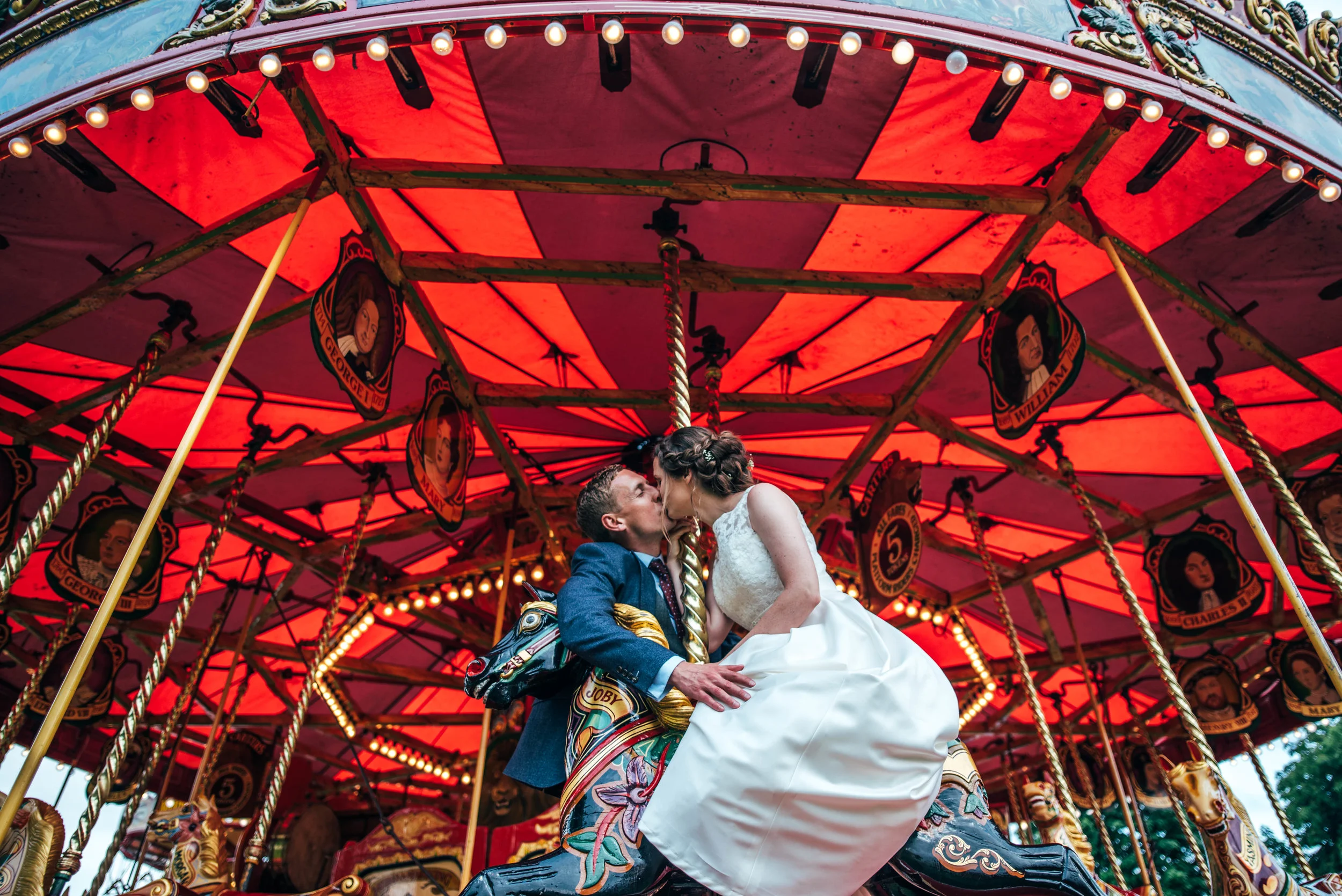 Bride & Groom on Merry go Round Steam Fair Wedding Essex Documentary Wedding Photographer