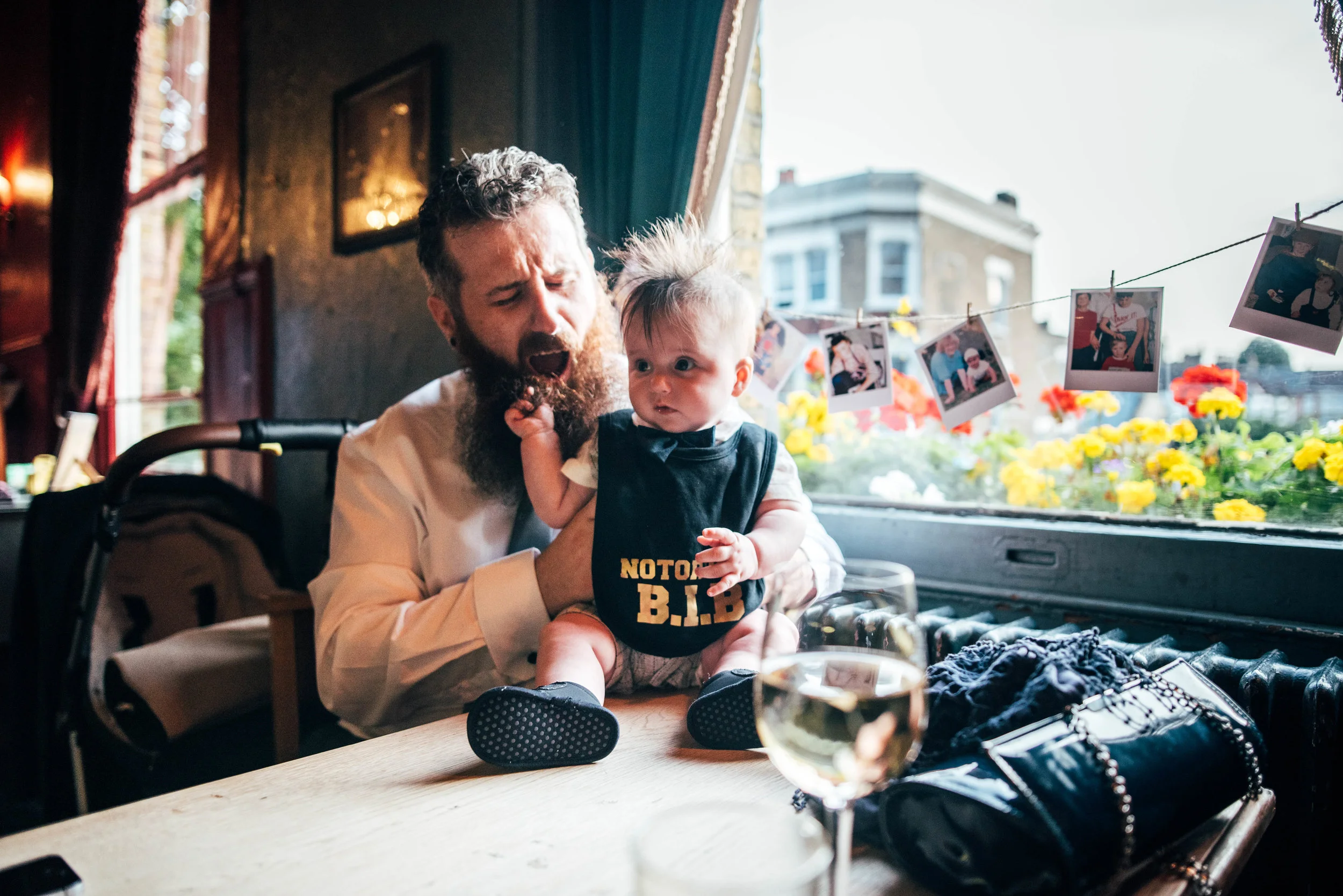 baby tugs on dads beard Asylum London Essex Documentary Wedding Photographer