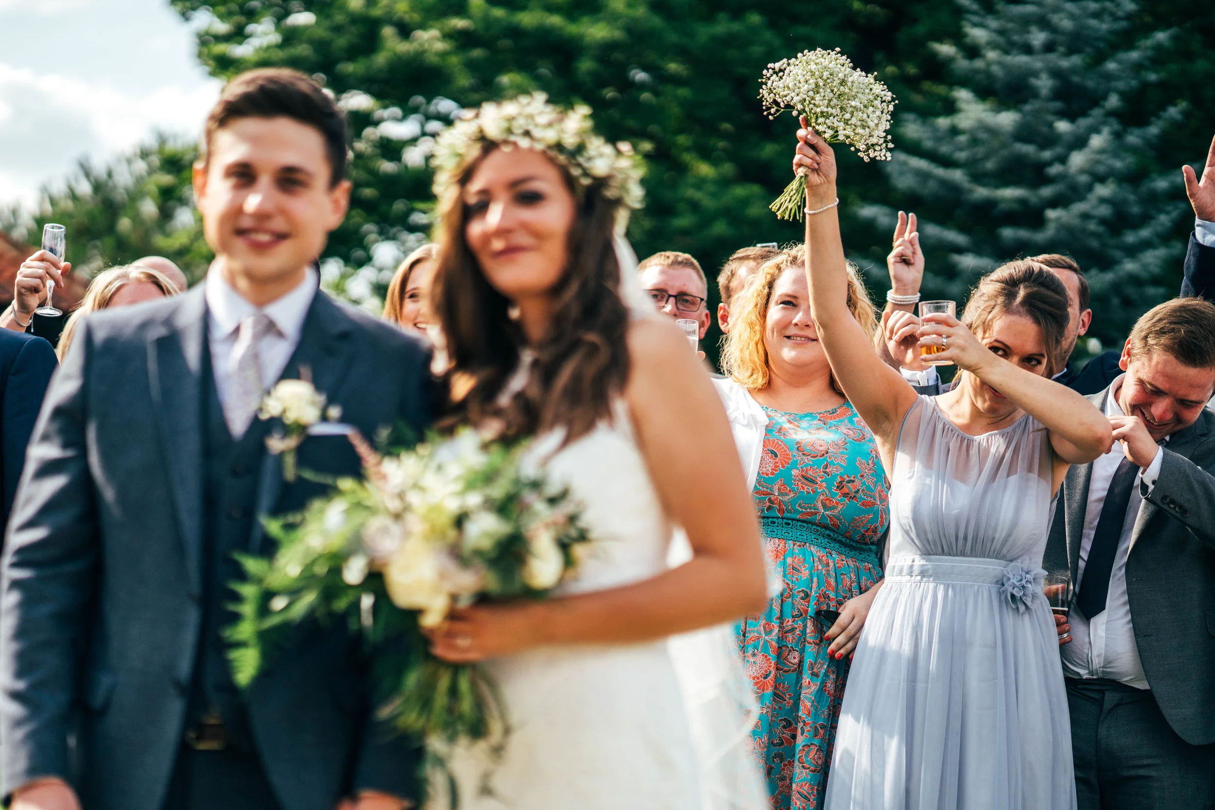 Guests Dab behind Bride and Groom Blake Hall Essex Documentary Wedding Photographer