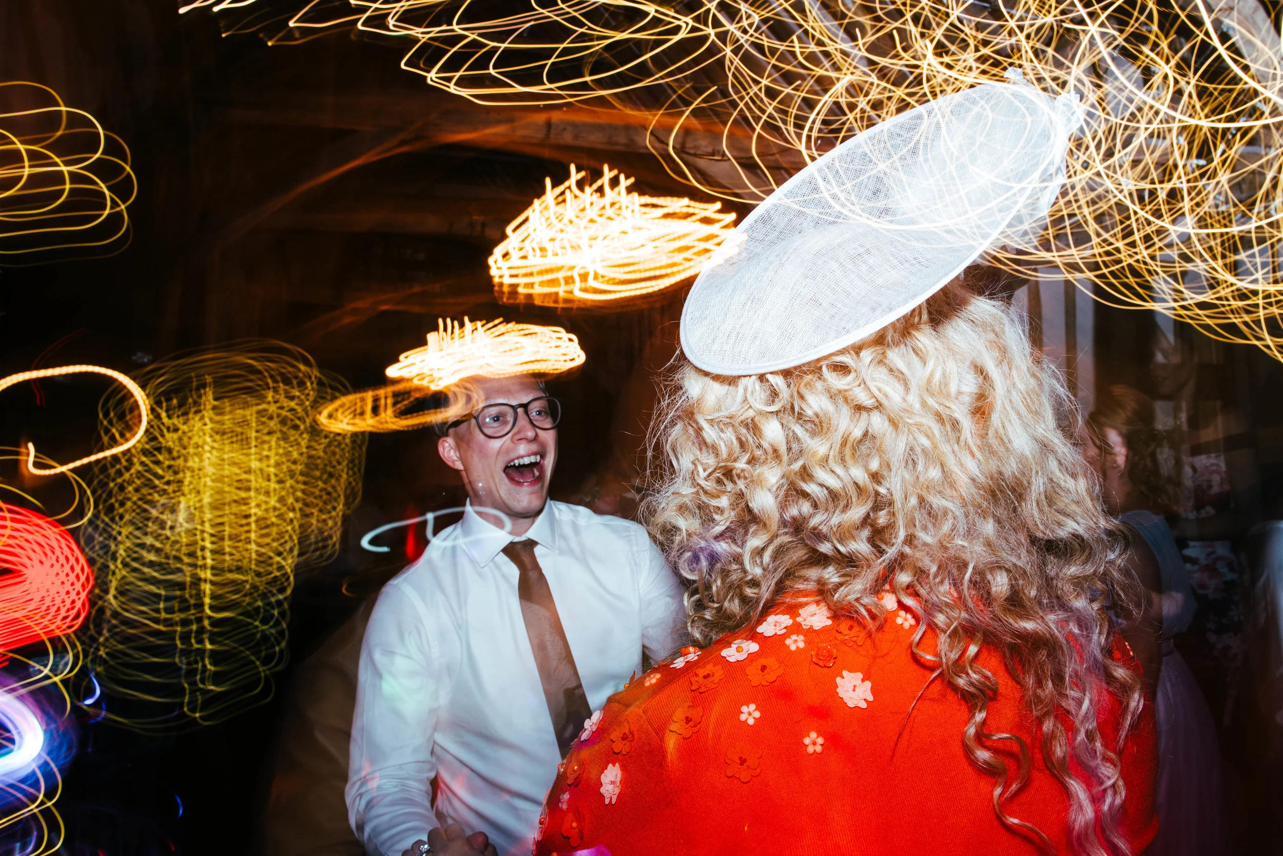Wedding guests on dance floor light drag Blake Hall Essex Documentary Wedding Photographer