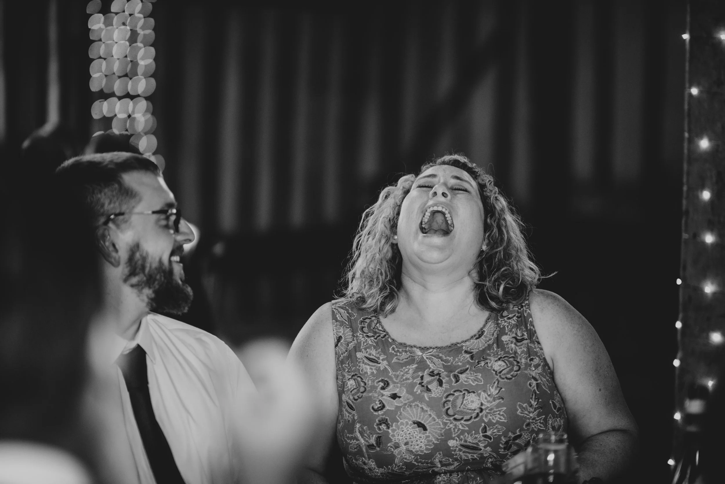 Wedding Guest laughs at speeches Blake Hall Essex Documentary Wedding Photographer
