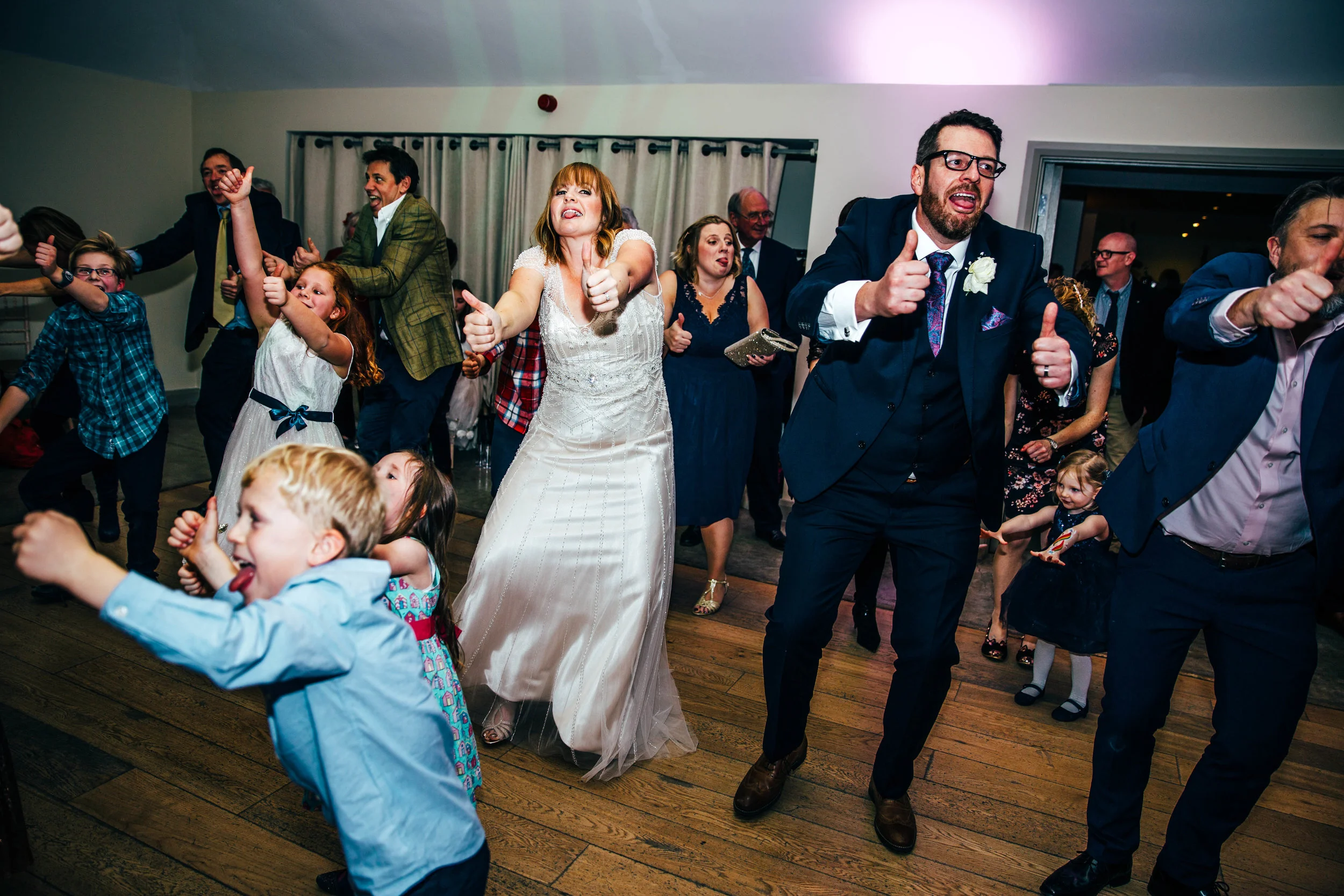 Bride Groom Guests on dance floor Houchins Farm Essex Documentary Wedding Photographer