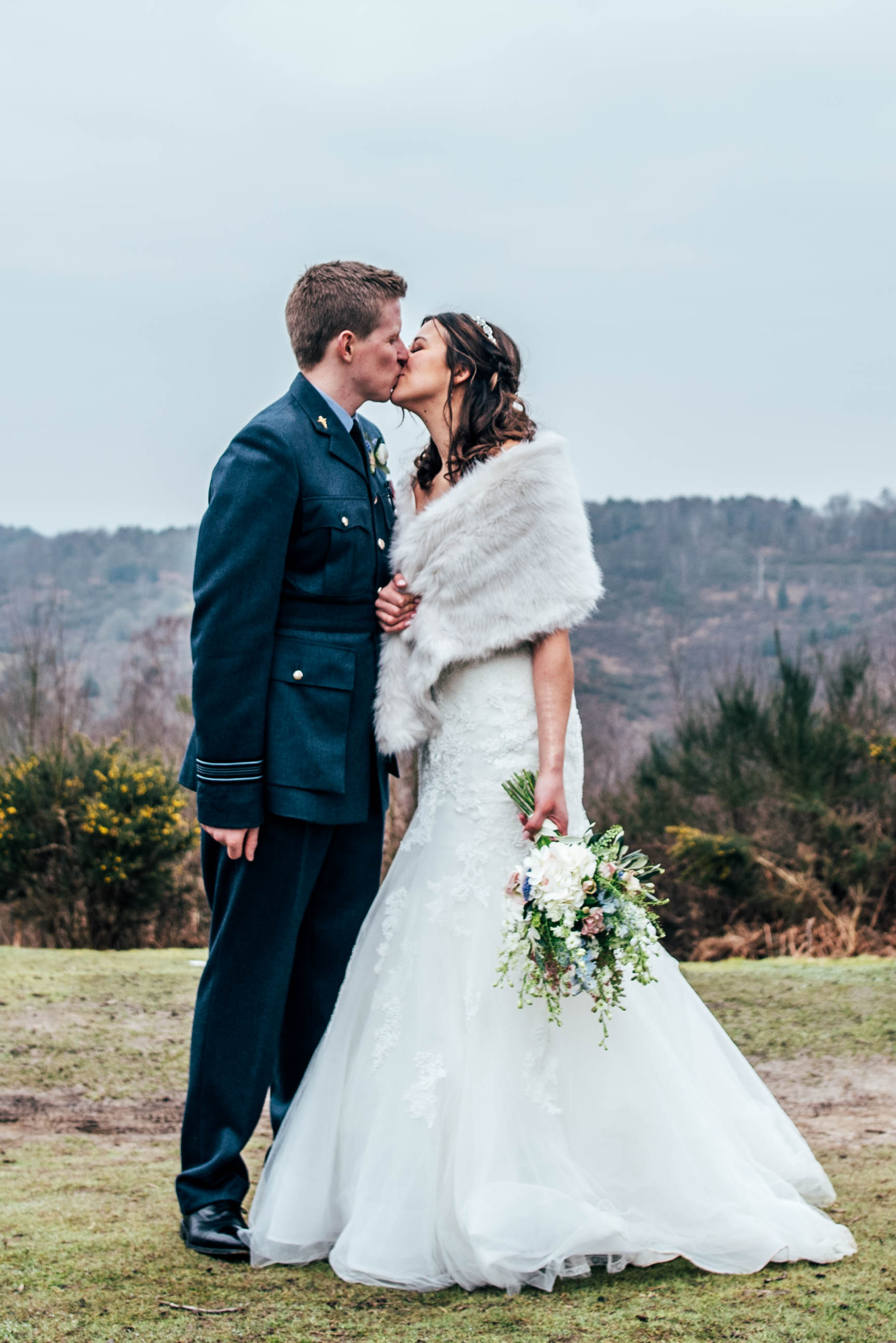 A Rustic DIY Spring Wedding St Nicholas' Church, Chawton & Chichester Hall, Witley. With trestle tables, wild flowers in bottles. Bride wears Pronovias. Essex Documentary Wedding Photographer