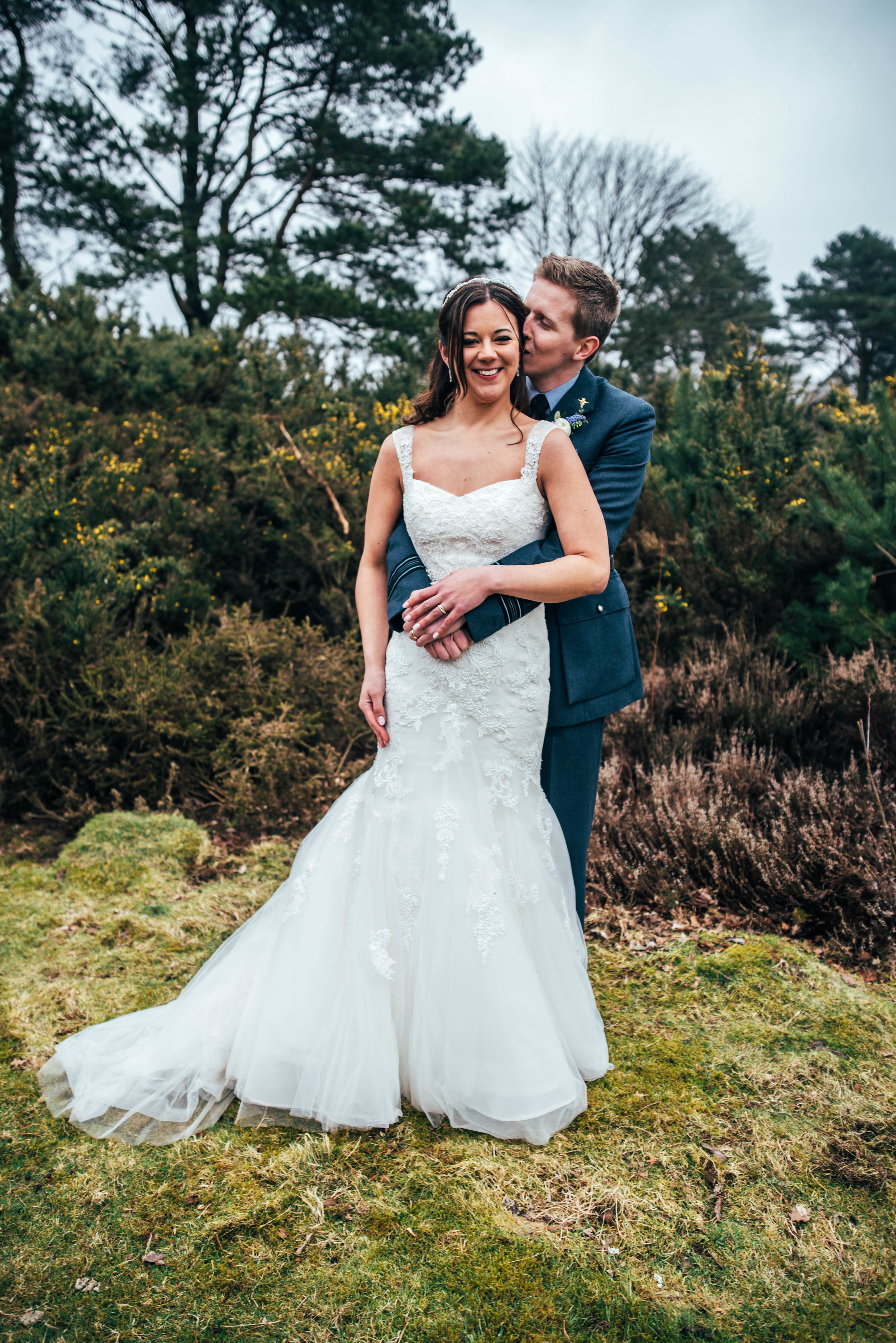 A Rustic DIY Spring Wedding St Nicholas' Church, Chawton & Chichester Hall, Witley. With trestle tables, wild flowers in bottles. Bride wears Pronovias. Essex Documentary Wedding Photographer
