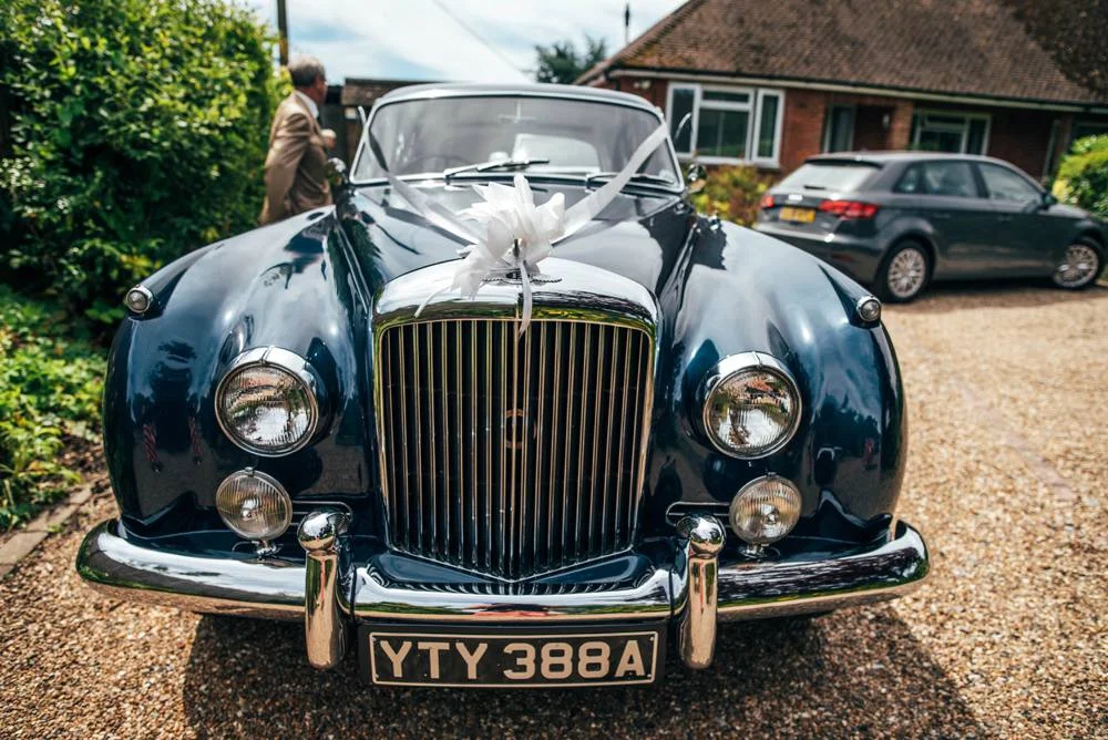 Rustic Summer wedding at Ratsbury Barn with Mini Golf, lawn games, pizza and home-made cake. Bride wears Mori Lee. Essex Documentary Wedding Photographer