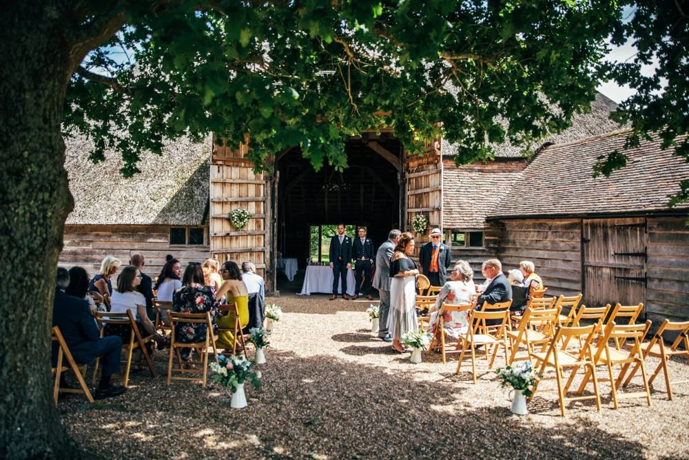 Rustic Summer wedding at Ratsbury Barn with Mini Golf, lawn games, pizza and home-made cake. Bride wears Mori Lee. Essex Documentary Wedding Photographer