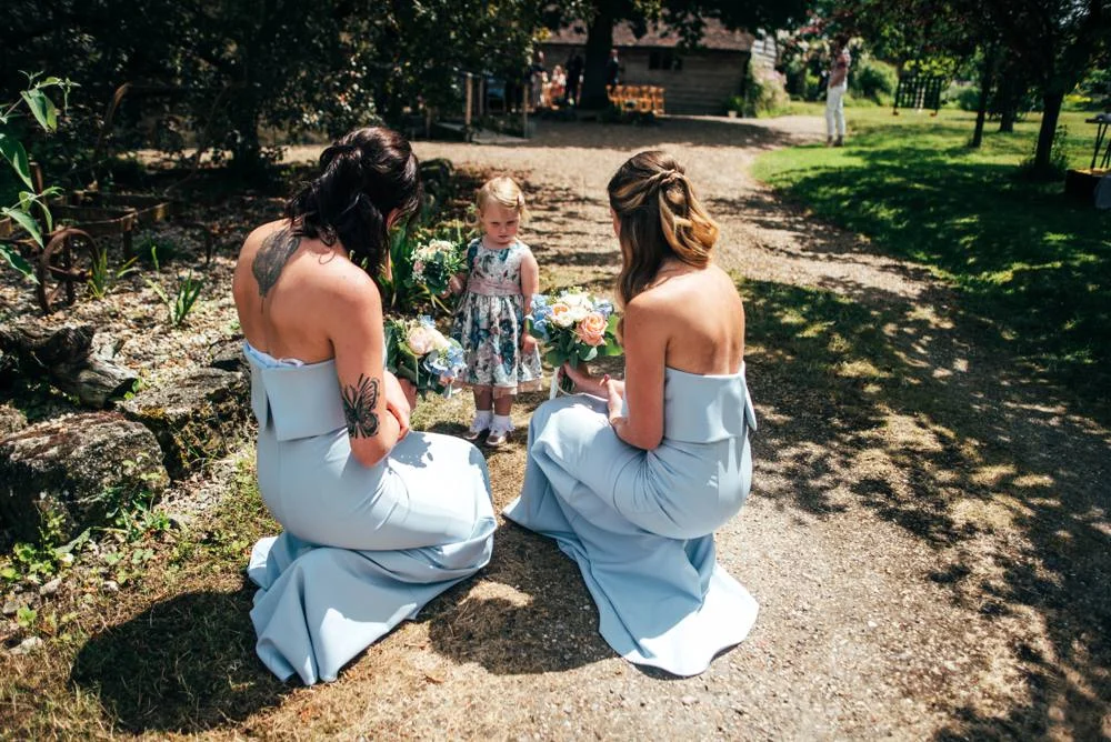 Rustic Summer wedding at Ratsbury Barn with Mini Golf, lawn games, pizza and home-made cake. Bride wears Mori Lee. Essex Documentary Wedding Photographer