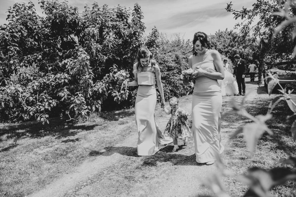 Rustic Summer wedding at Ratsbury Barn with Mini Golf, lawn games, pizza and home-made cake. Bride wears Mori Lee. Essex Documentary Wedding Photographer