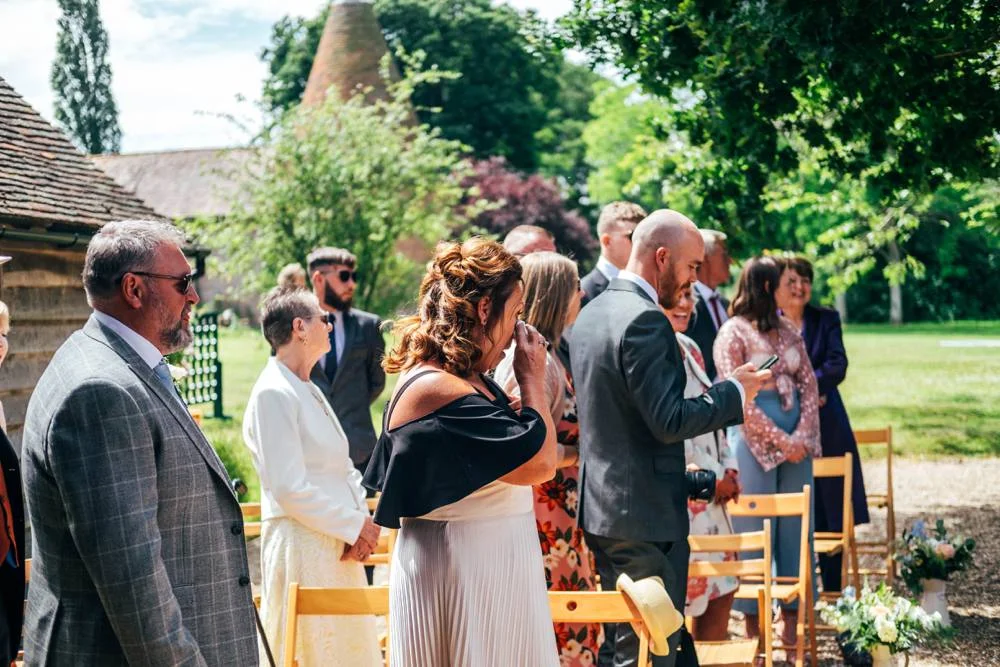 Rustic Summer wedding at Ratsbury Barn with Mini Golf, lawn games, pizza and home-made cake. Bride wears Mori Lee. Essex Documentary Wedding Photographer