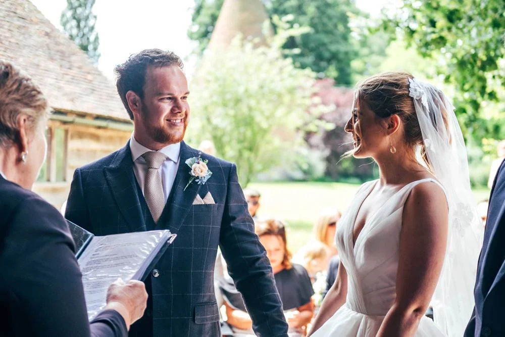 Rustic Summer wedding at Ratsbury Barn with Mini Golf, lawn games, pizza and home-made cake. Bride wears Mori Lee. Essex Documentary Wedding Photographer