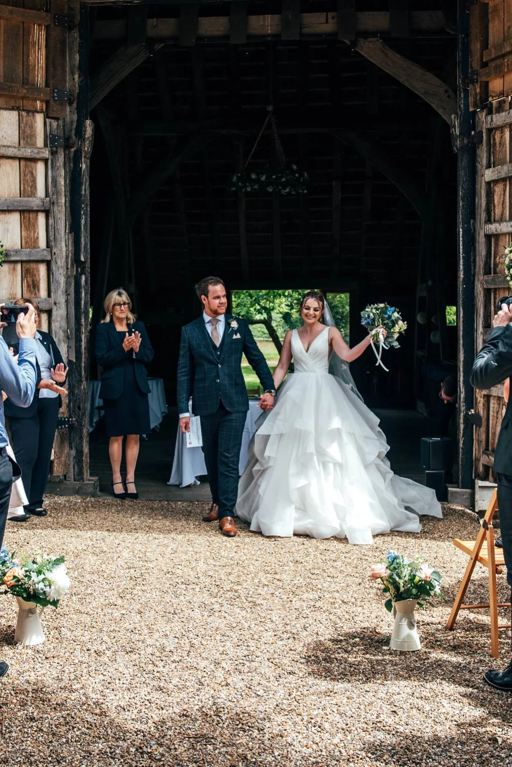 Rustic Summer wedding at Ratsbury Barn with Mini Golf, lawn games, pizza and home-made cake. Bride wears Mori Lee. Essex Documentary Wedding Photographer