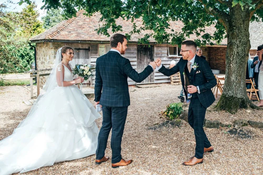 Rustic Summer wedding at Ratsbury Barn with Mini Golf, lawn games, pizza and home-made cake. Bride wears Mori Lee. Essex Documentary Wedding Photographer