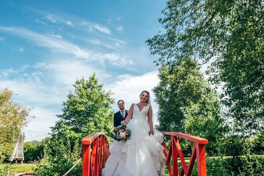Rustic Summer wedding at Ratsbury Barn with Mini Golf, lawn games, pizza and home-made cake. Bride wears Mori Lee. Essex Documentary Wedding Photographer