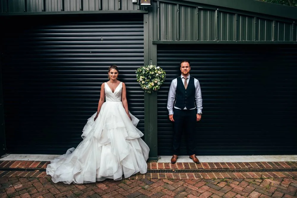 Rustic Summer wedding at Ratsbury Barn with Mini Golf, lawn games, pizza and home-made cake. Bride wears Mori Lee. Essex Documentary Wedding Photographer