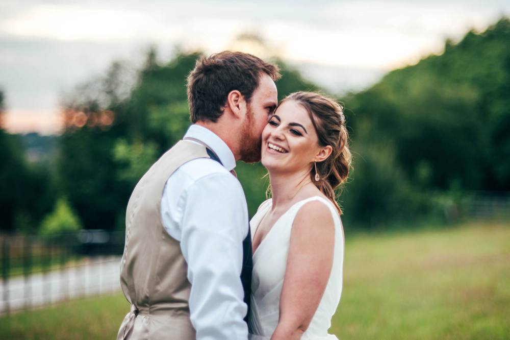 Rustic Summer wedding at Ratsbury Barn with Mini Golf, lawn games, pizza and home-made cake. Bride wears Mori Lee. Essex Documentary Wedding Photographer