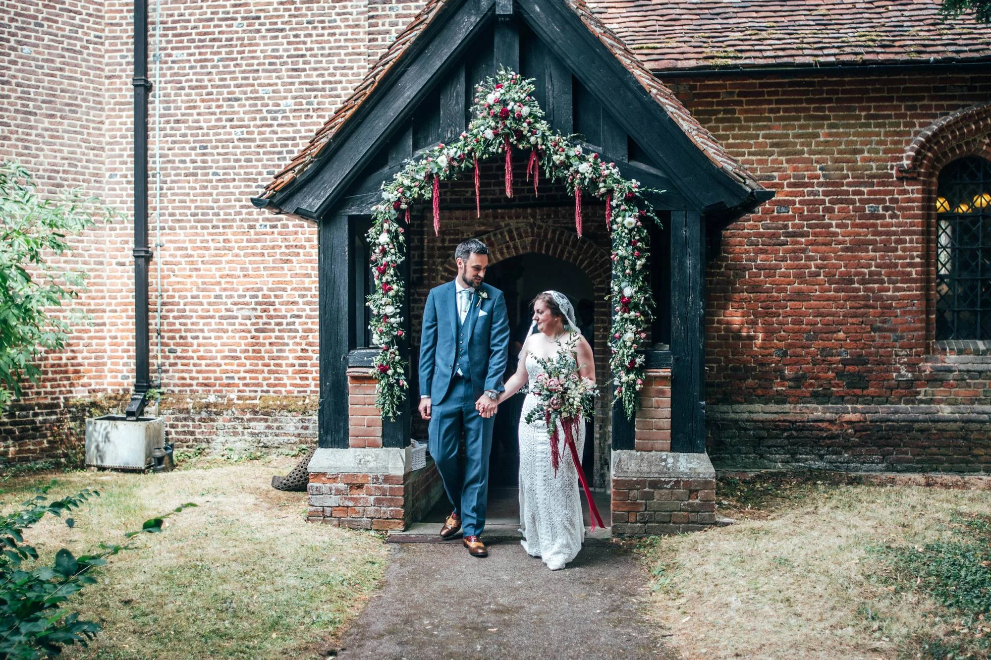 East Anglian Railway Museum Wedding. Vintage lace with Red &amp; Light Blue Palette with Proteas Bouquet. Essex Documentary Wedding Photographer
