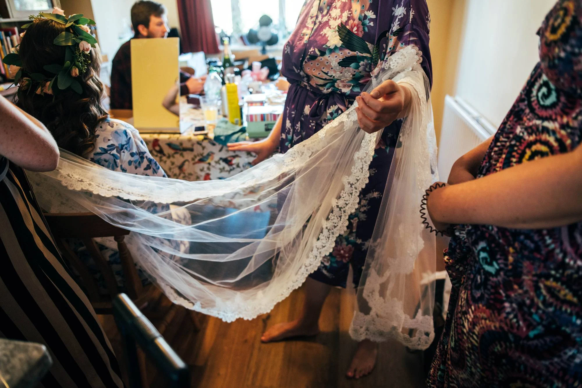 Ely Cathedral with a DIY, Boho Farm Wedding Reception at Bedingham's Farm , Bride wears Willowby by Watters and a Flower Crown. Essex Documentary Wedding Photographer.