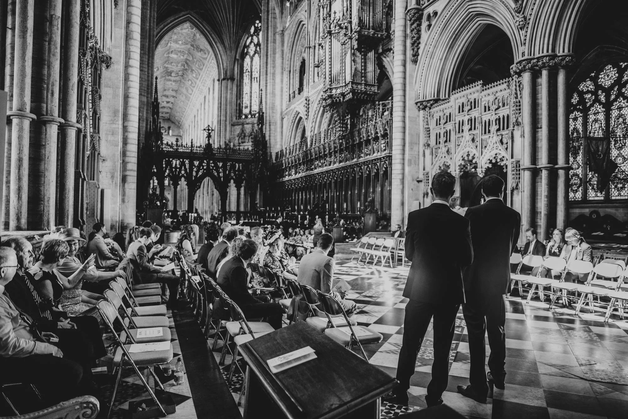 Ely Cathedral with a DIY, Boho Farm Wedding Reception at Bedingham's Farm , Bride wears Willowby by Watters and a Flower Crown. Essex Documentary Wedding Photographer.
