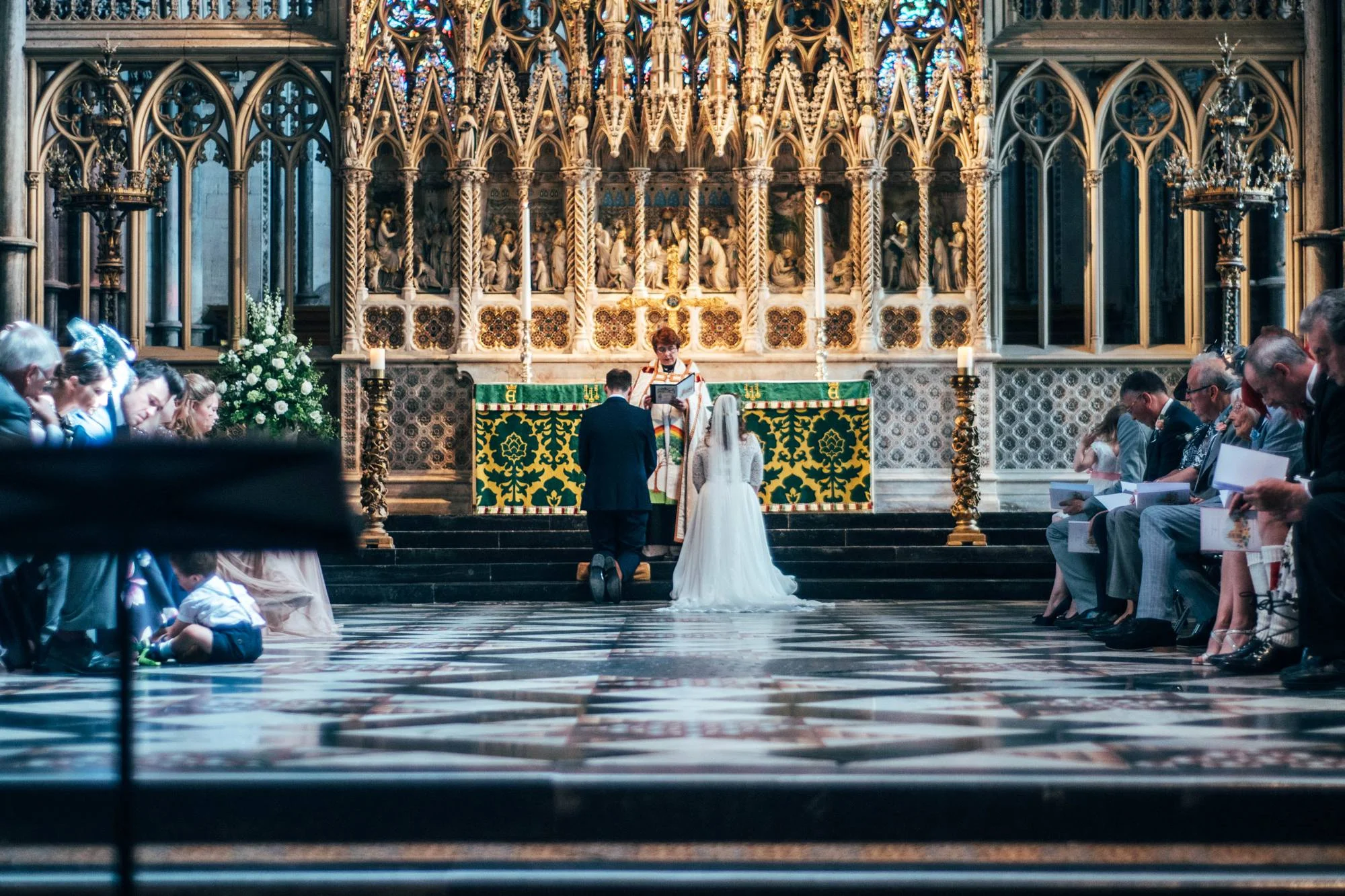 Ely Cathedral with a DIY, Boho Farm Wedding Reception at Bedingham's Farm , Bride wears Willowby by Watters and a Flower Crown. Essex Documentary Wedding Photographer.