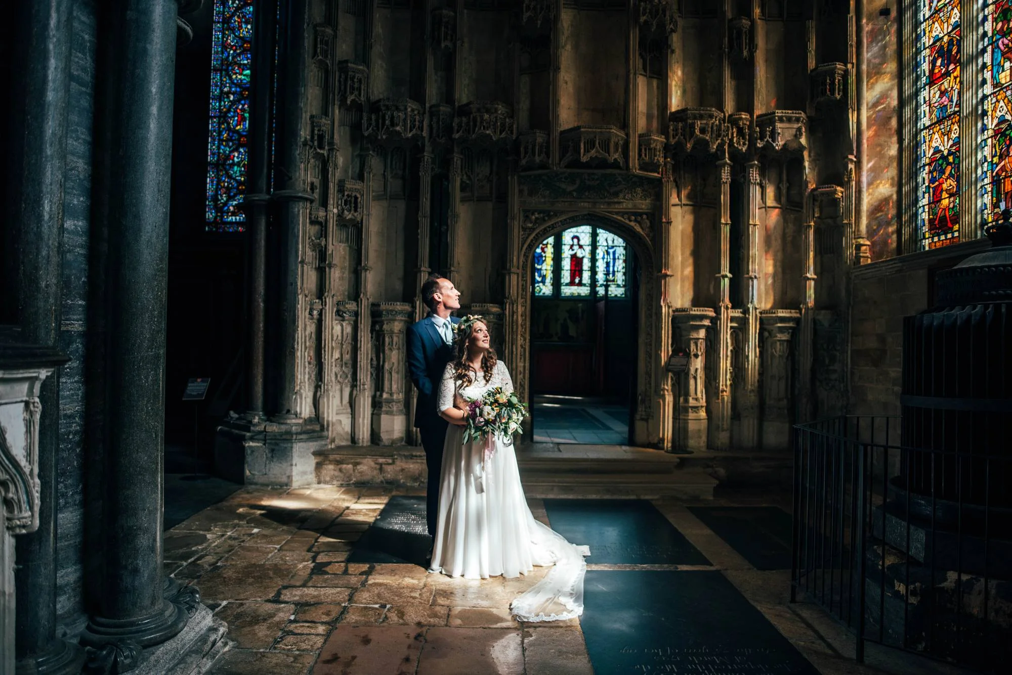 Ely Cathedral with a DIY, Boho Farm Wedding Reception at Bedingham's Farm , Bride wears Willowby by Watters and a Flower Crown. Essex Documentary Wedding Photographer.
