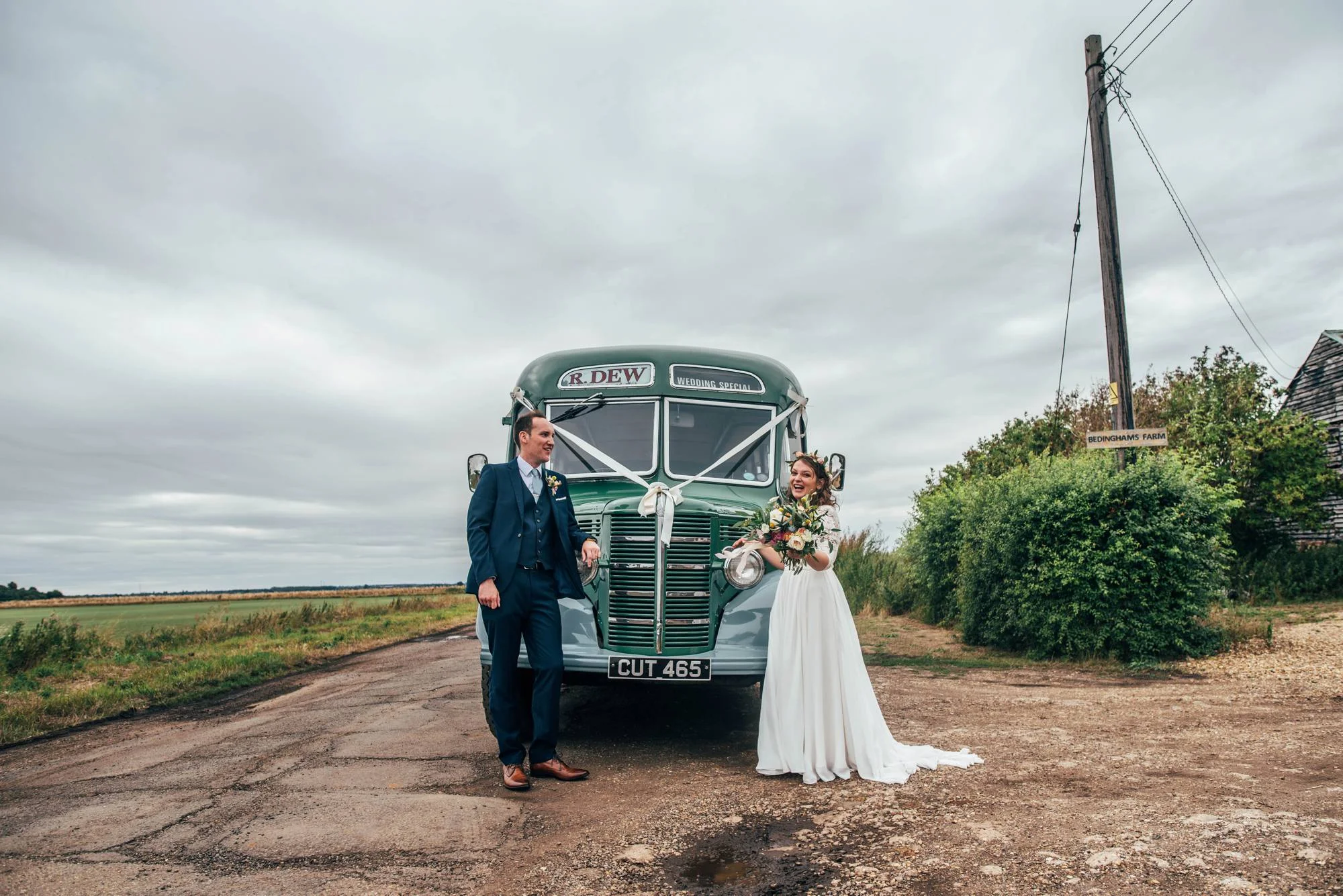 Ely Cathedral with a DIY, Boho Farm Wedding Reception at Bedingham's Farm , Bride wears Willowby by Watters and a Flower Crown. Essex Documentary Wedding Photographer.