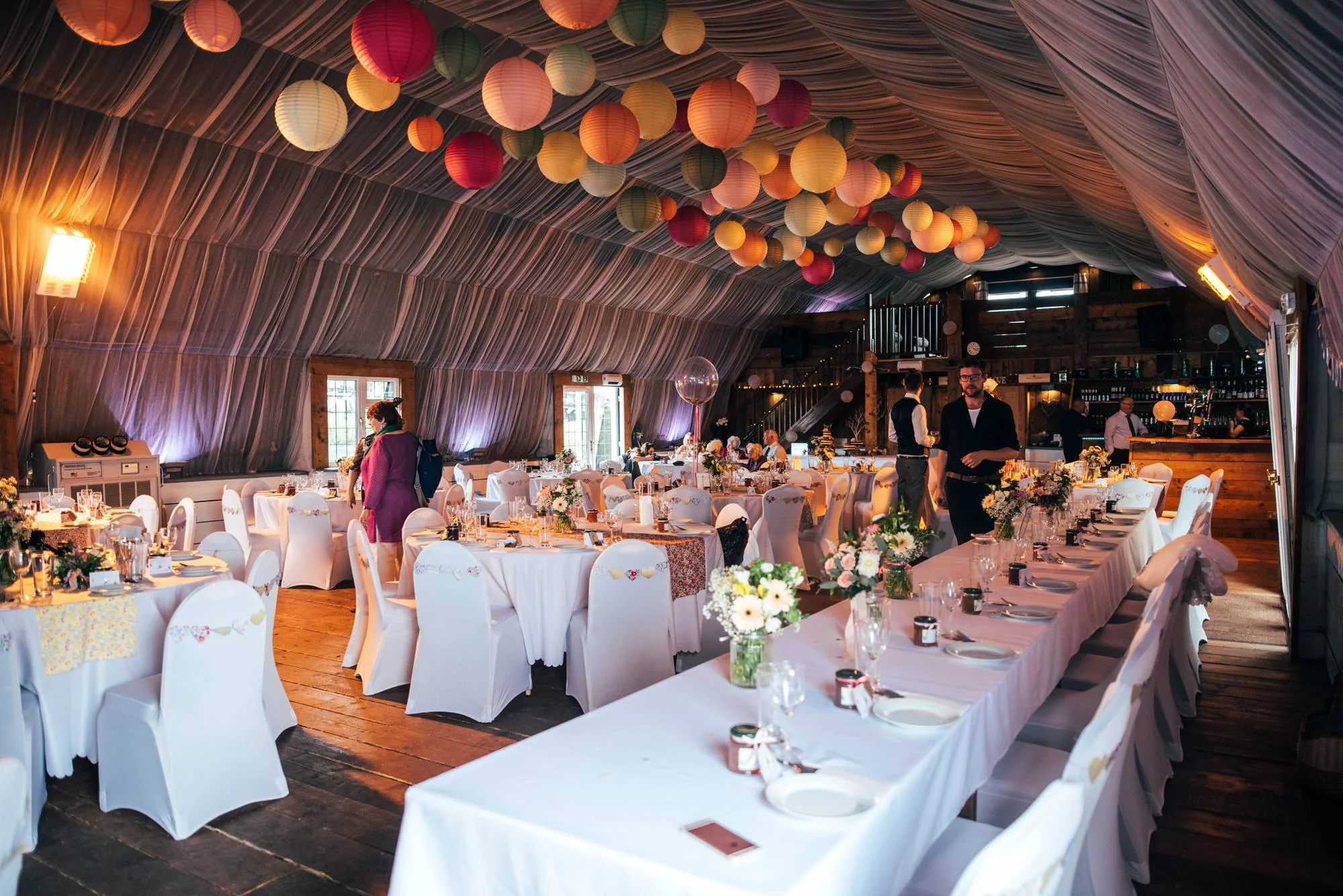 Ely Cathedral with a DIY, Boho Farm Wedding Reception at Bedingham's Farm , Bride wears Willowby by Watters and a Flower Crown. Essex Documentary Wedding Photographer.