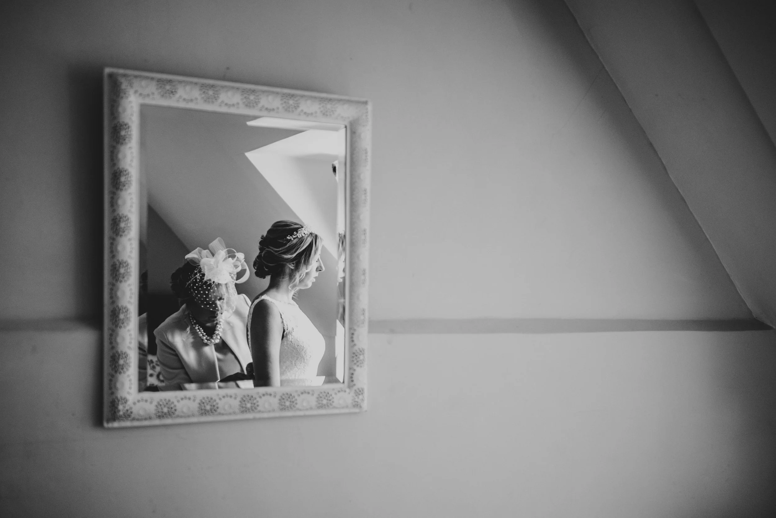 Brides Mum fastens her dress at Houchins Farm, Coggeshall, Essex Documentary Wedding Photographer