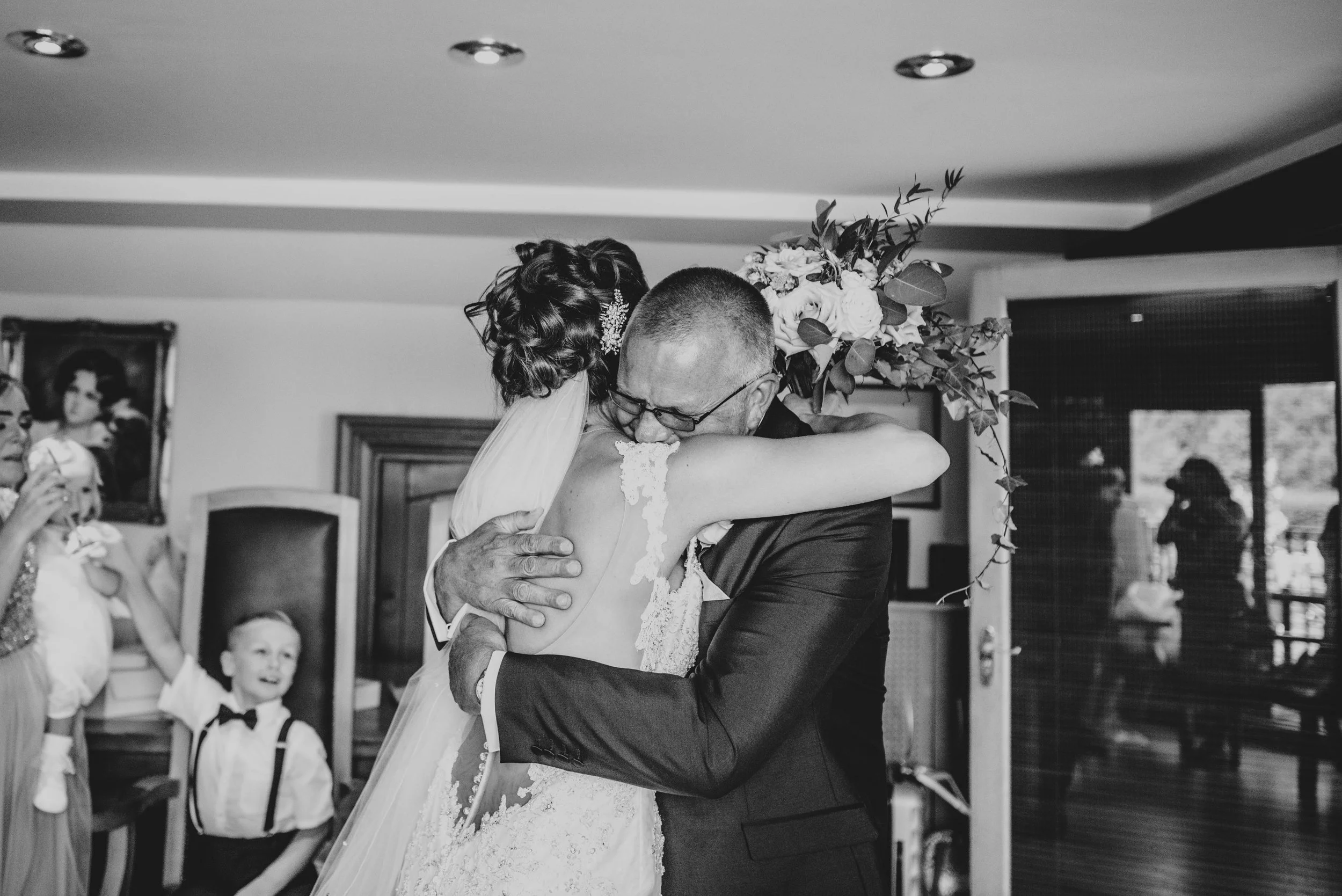 Emotional Father of Bride hugs Bride at Stock Brook Manor, Billericay.  Essex Documentary Wedding Photographer