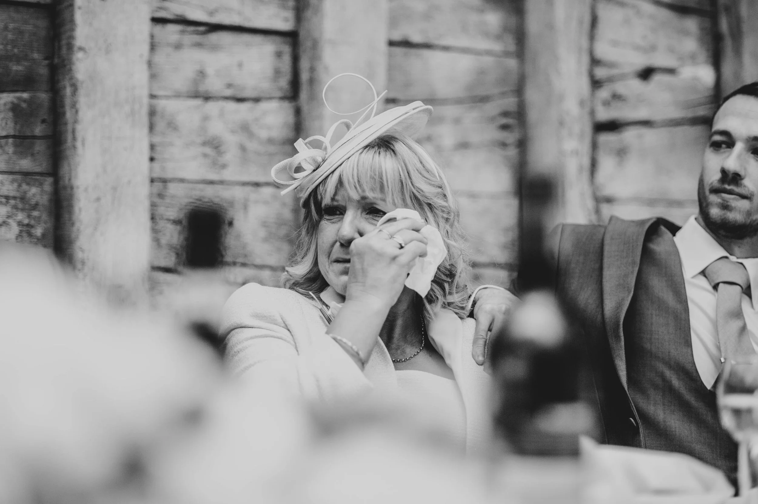 Mother of Groom wipes away tear at speeches Blake Hall, Ongar, Essex Documentary Wedding Photographer