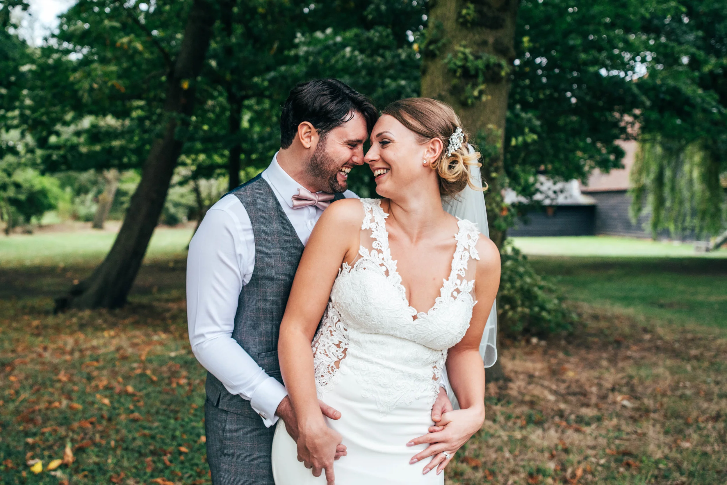 Bride and Groom in gardens at Blake Hall, Ongar, Essex Documentary Wedding Photographer