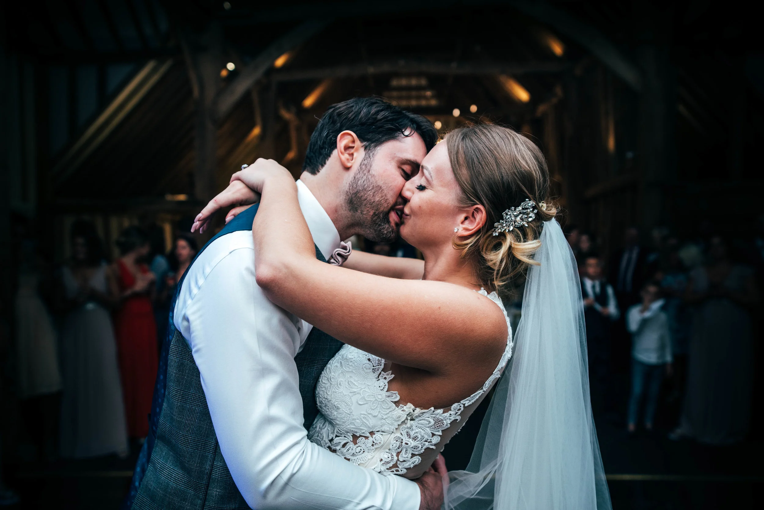 Bride and Groom kiss on dance floor at Blake Hall, Ongar, Essex Documentary Wedding Photographer 