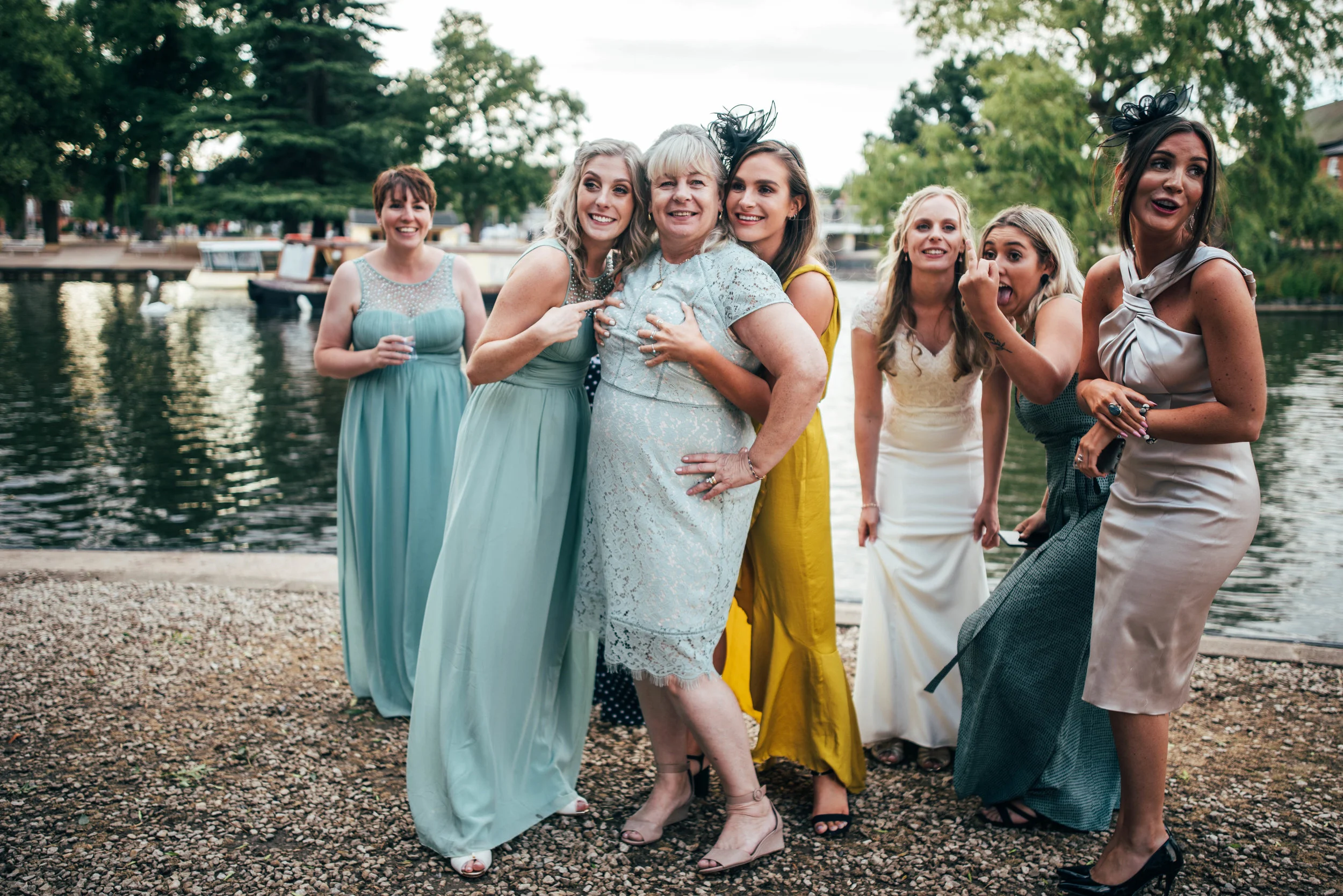 Wedding guest grab each other Essex Documentary Wedding Photographer