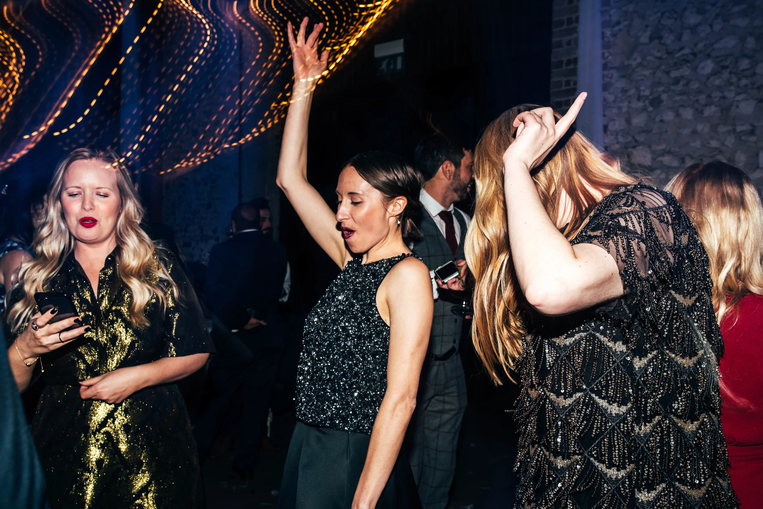 wedding guests on dance floor at Hedingham Castle, Essex Documentary Wedding Photographer