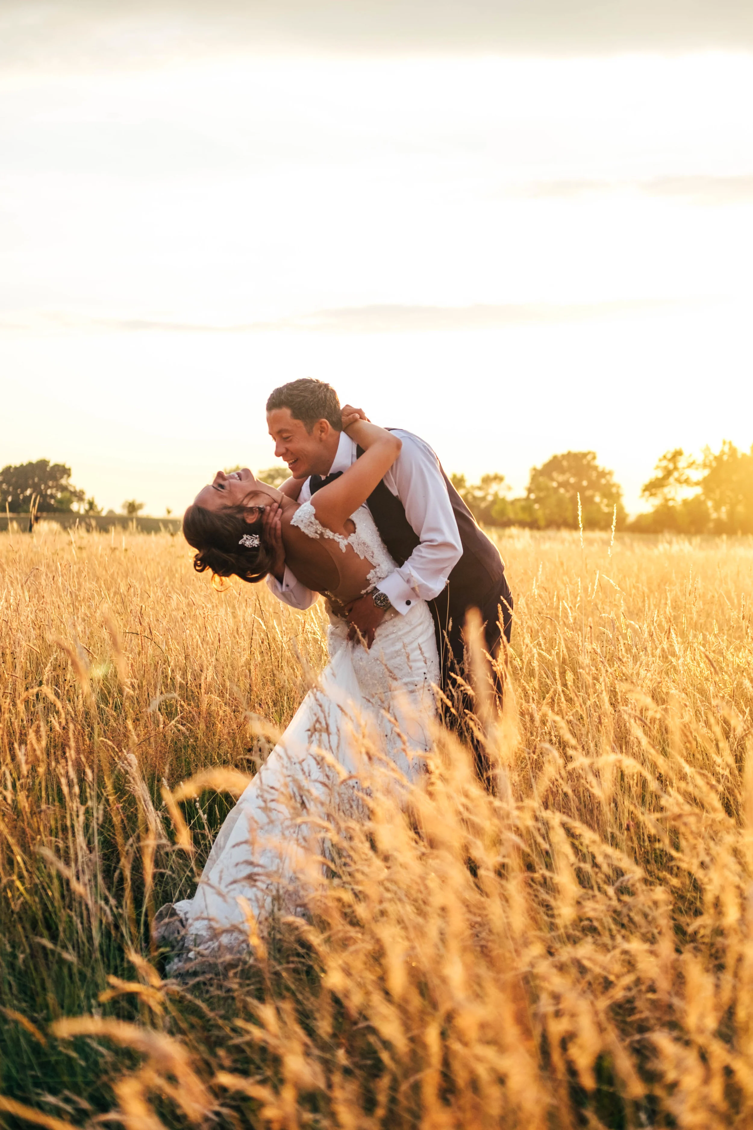 Bride &amp; Groom in cornfield at Sunset Stock Brook Manor Billericay Essex Documentary Wedding Photographer