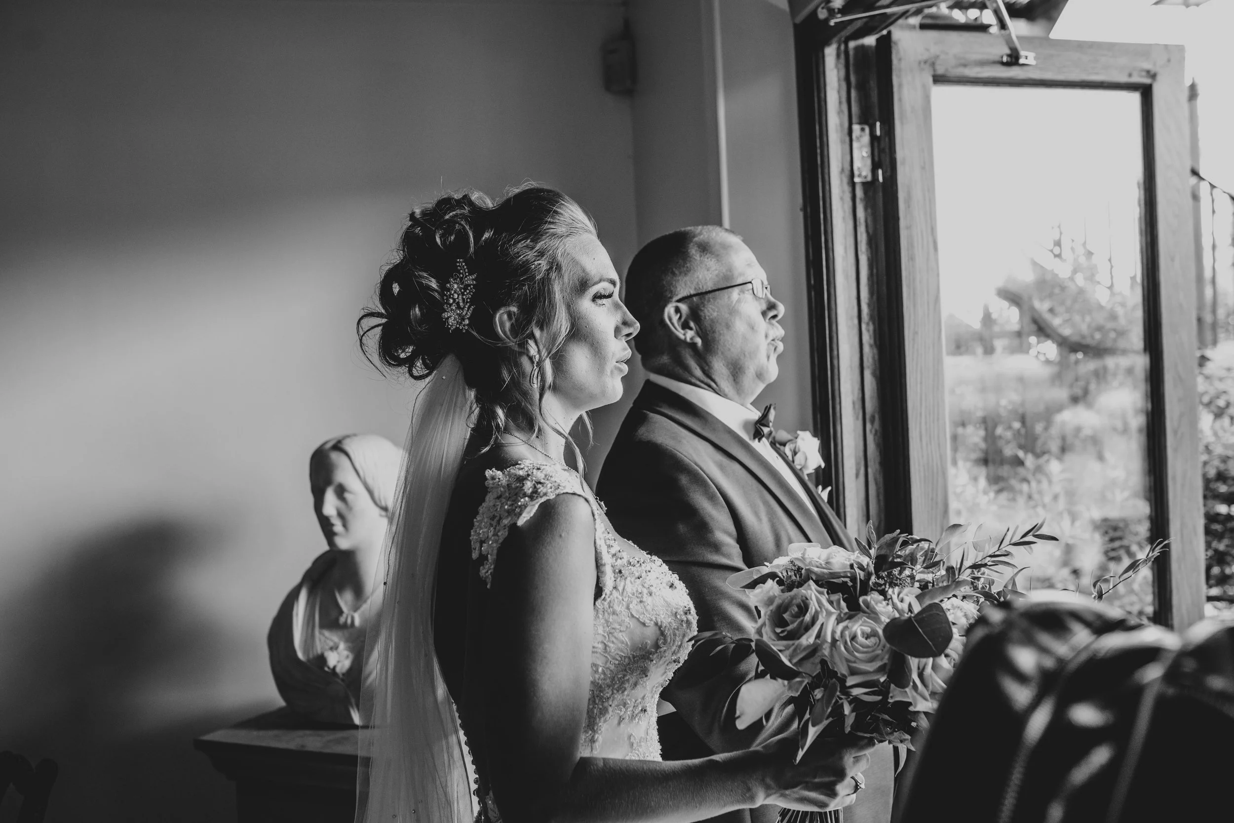 Bride & her Father both take deep breath before walking down the aisle Essex documentary Wedding Photographer