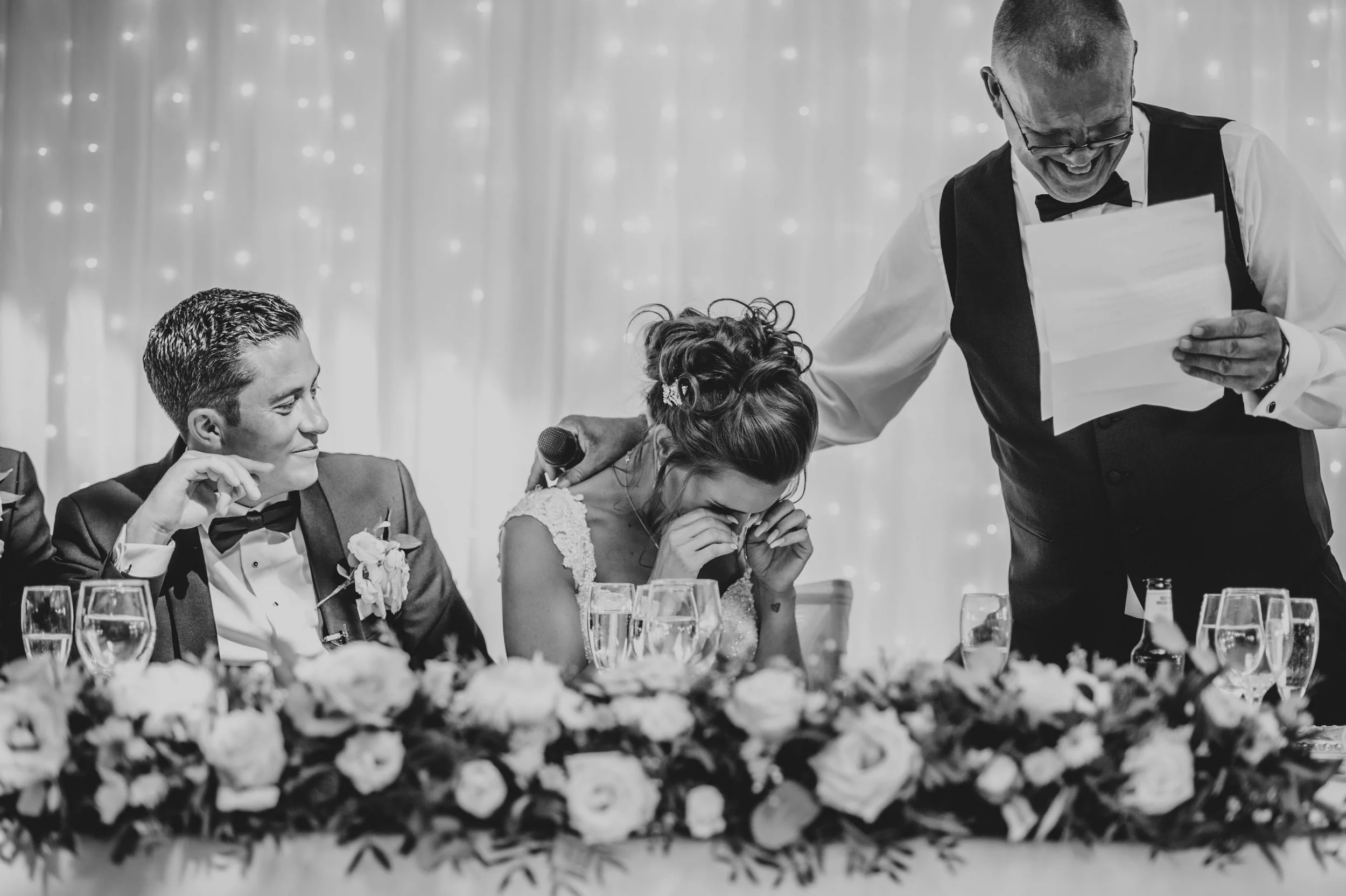 Bride is comforted by her Dad during speeches Essex Documentary Wedding Photographer