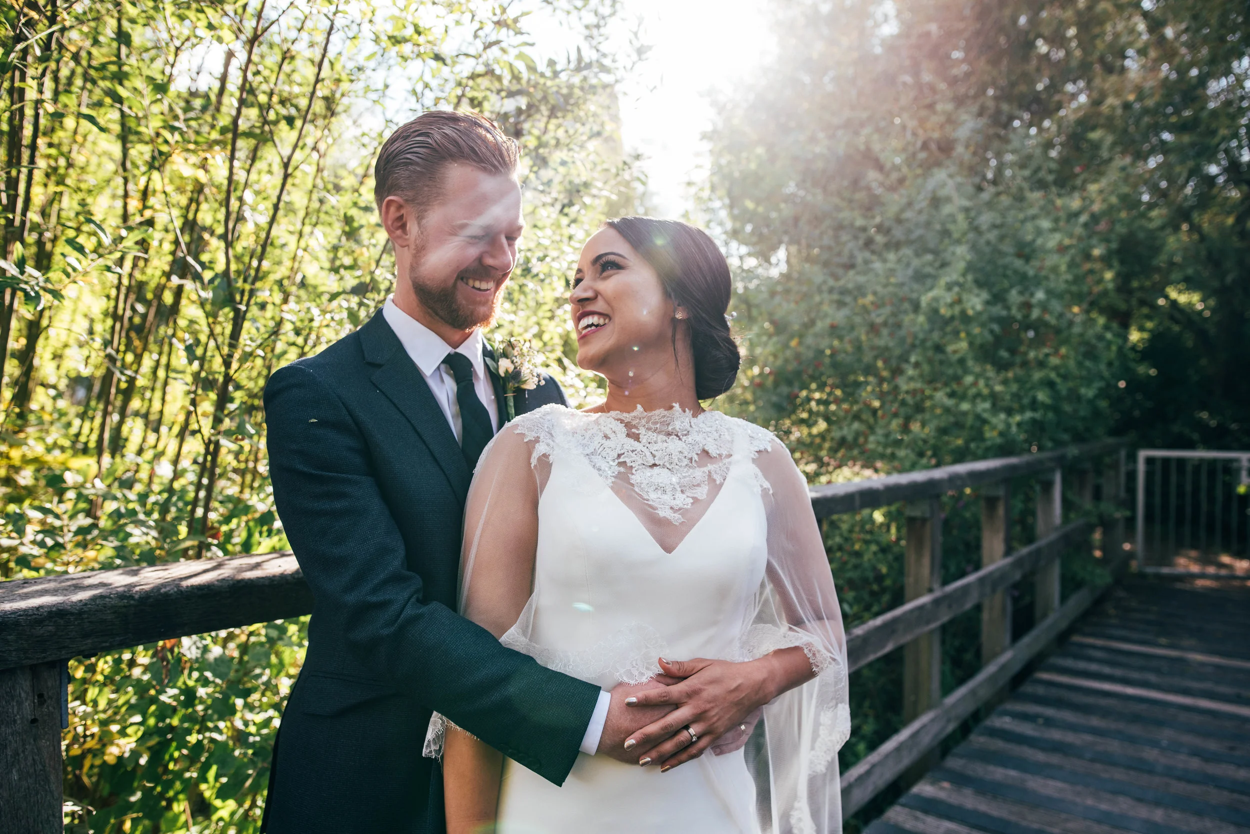 Bride & Groom in autumn sun at Mile End Ecology Pavilion Essex Documentary Wedding Photographer