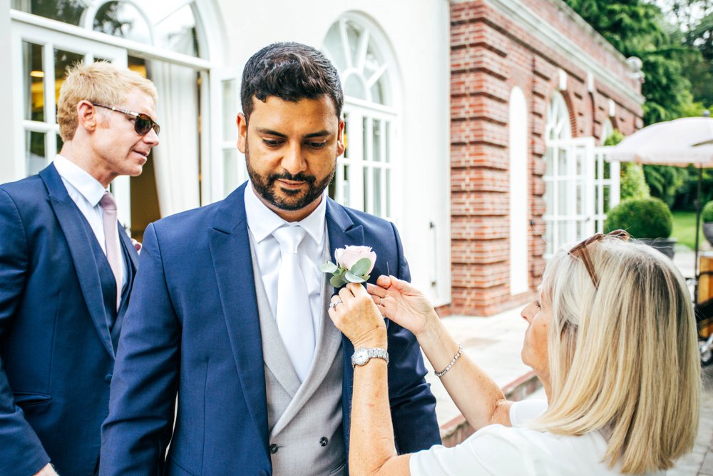 An outdoor Summer Wedding at The Orangery, Maidstone. Blush Pinks and lace with rustic detail. Essex Documentary Wedding Photographer