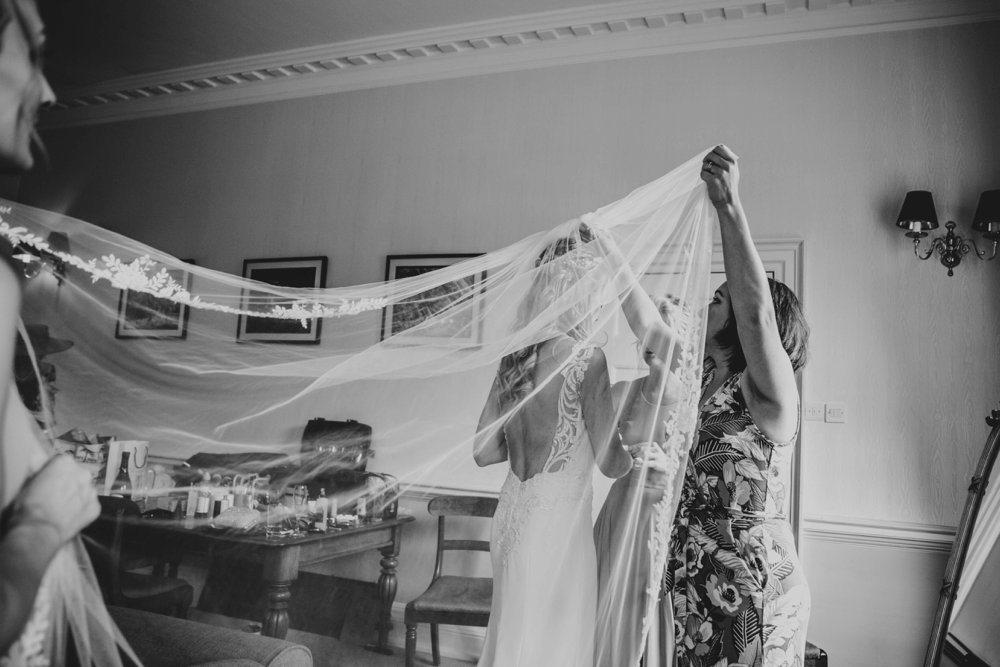 An outdoor Summer Wedding at The Orangery, Maidstone. Blush Pinks and lace with rustic detail. Essex Documentary Wedding Photographer