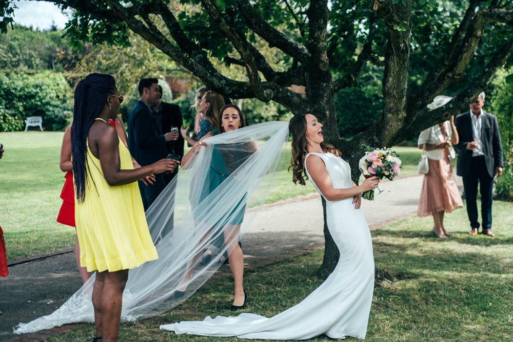 Travel Inspired Summer Wedding at Gaynes Park with Bridesmaids in Boho Floral Pink. Three Flowers Photography