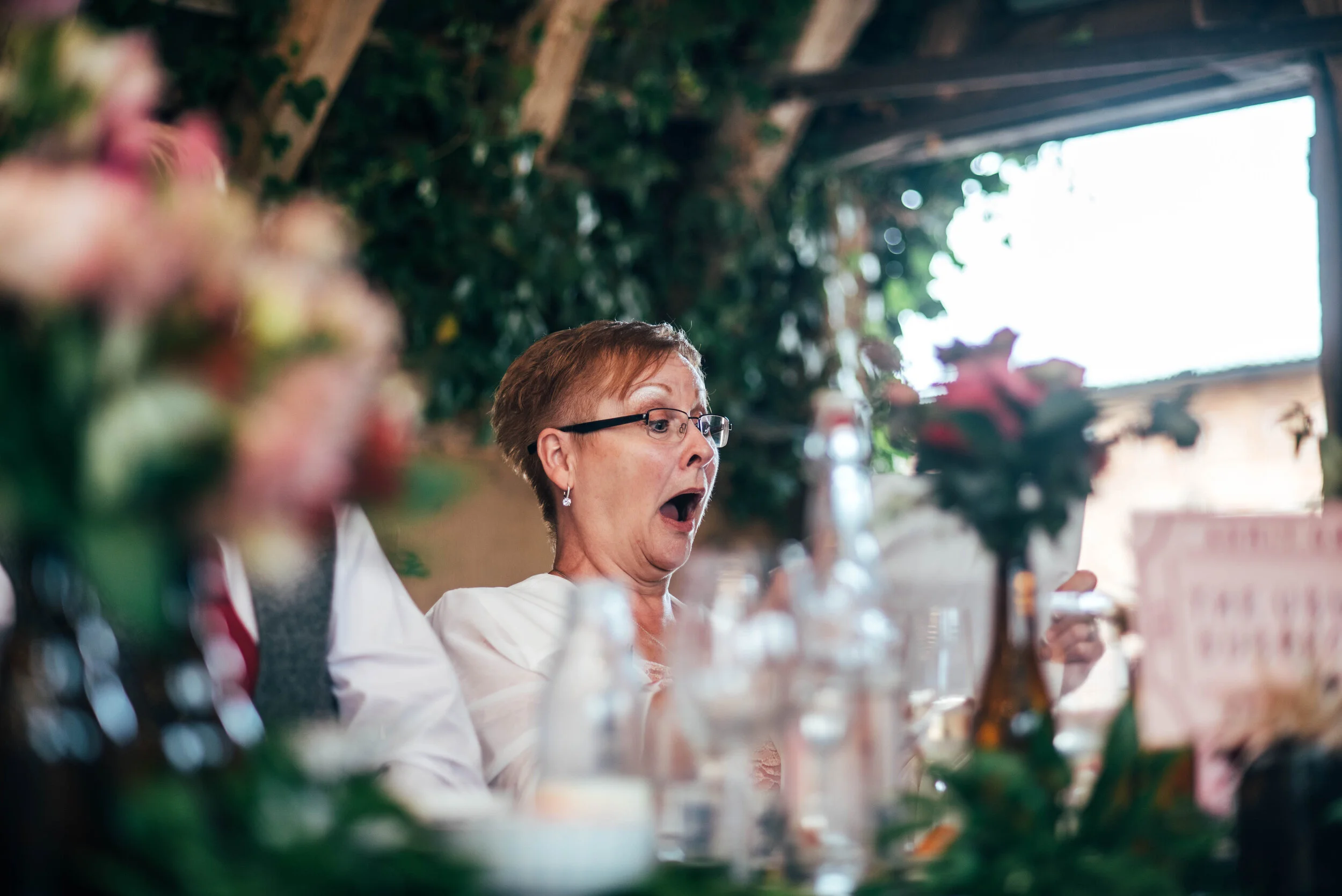 Wedding guest shocked at speeches at The House Meadow, Kent. Essex Documentary Wedding Photographer. Three Flowers Photography