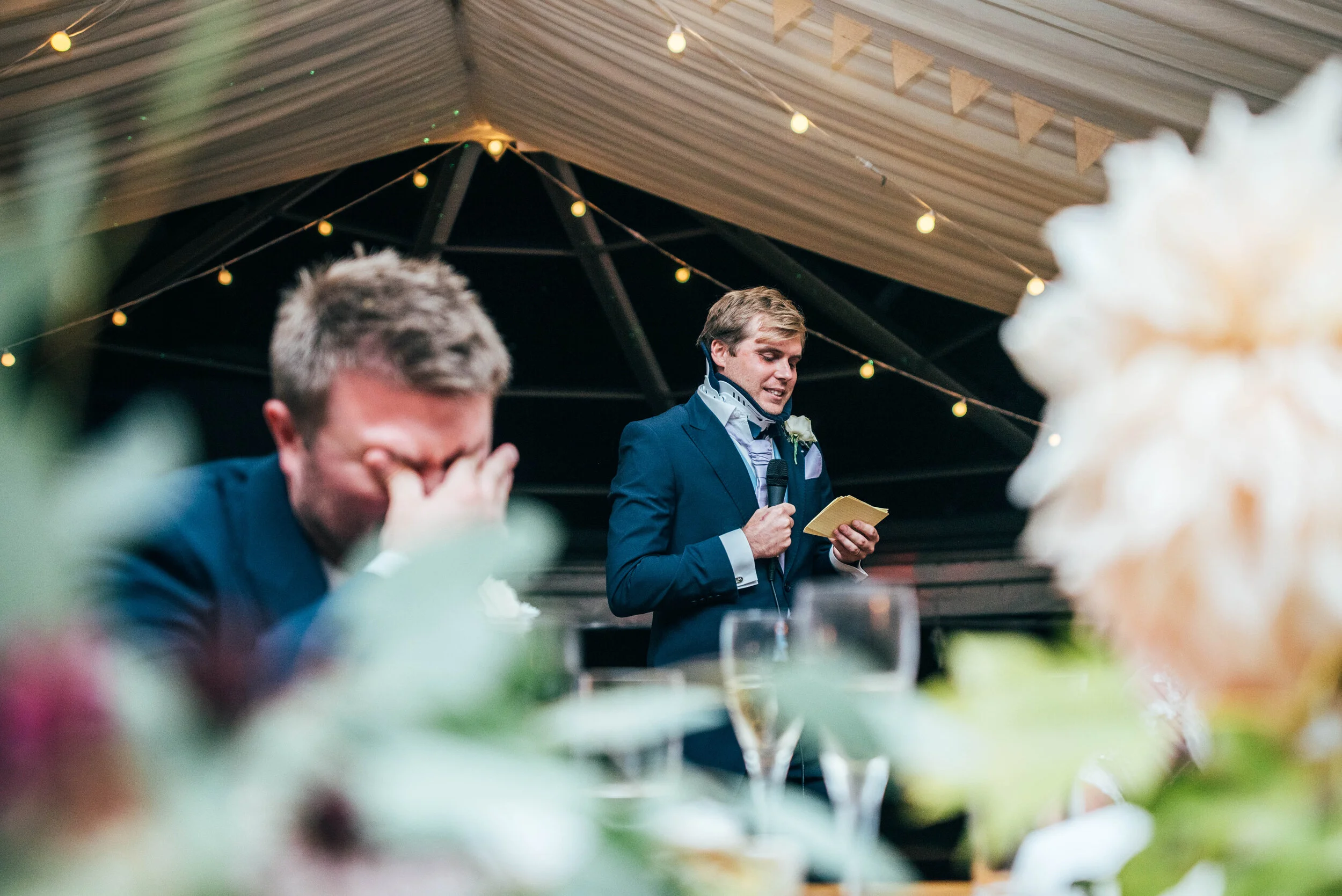 Groom hides face during Best Man speech. DIY Back garden wedding. Essex documentary wedding photographer. Three Flowers Photography