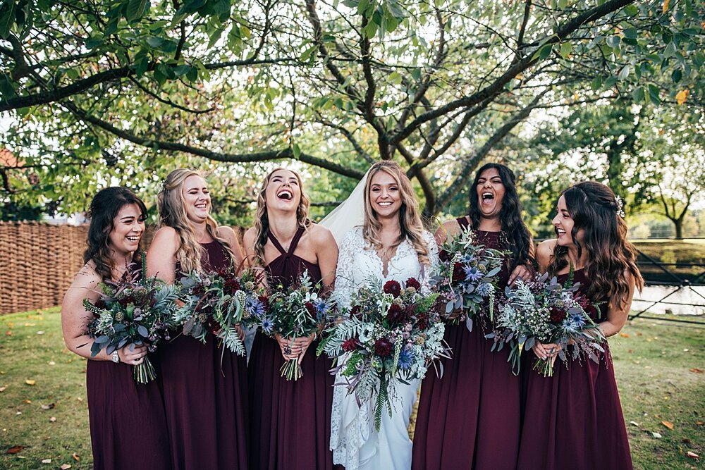 A rich &amp; lush autumn wedding at Blake Hall. Deep Reds with pumpkins &amp; Pampass grass. Essex Documentary Wedding Photographer