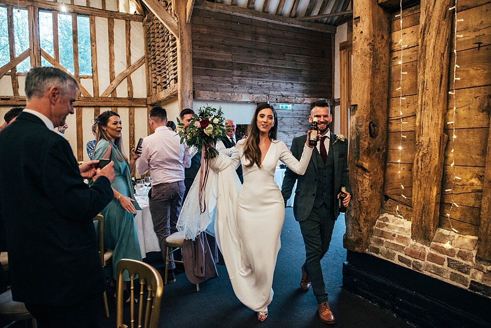 Deep Reds &amp; The Beatles with Tea Cup Piggies for a Rainy, Autumn wedding at Blake Hall. Essex Documentary Wedding Photographer 
