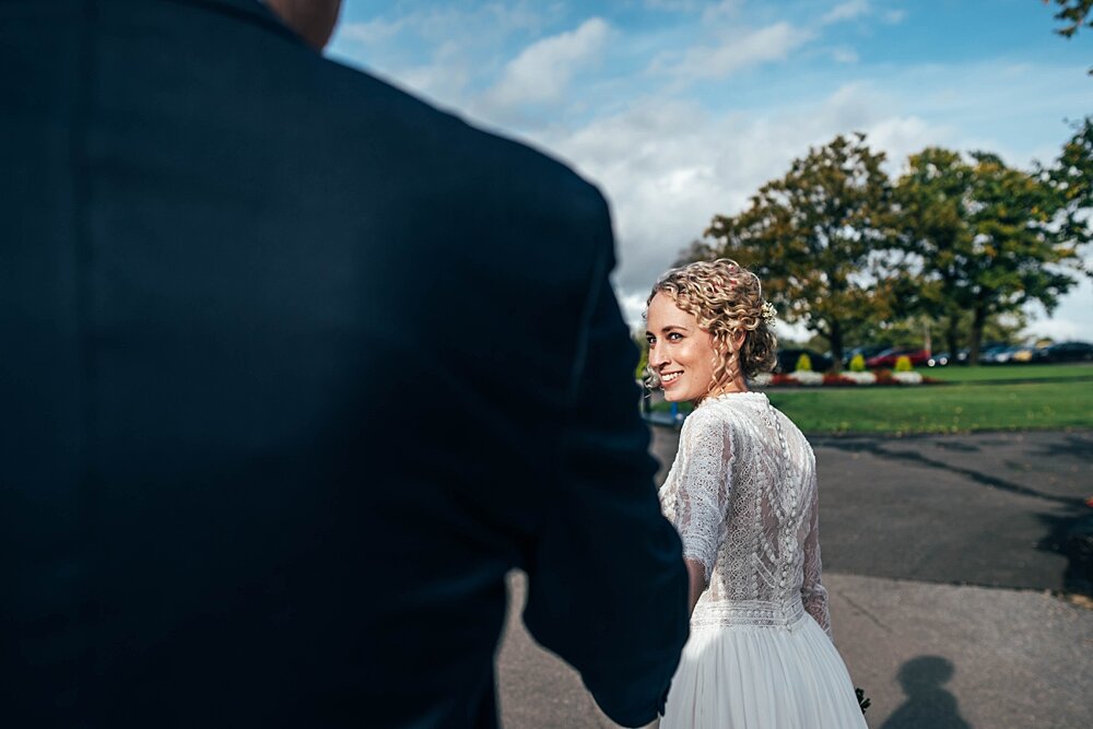 Autumn barn wedding at Crondon Park with rich reds and an ethereal Pronovias gown with Game of Throne vibes! Essex Documentary Wedding Photographer