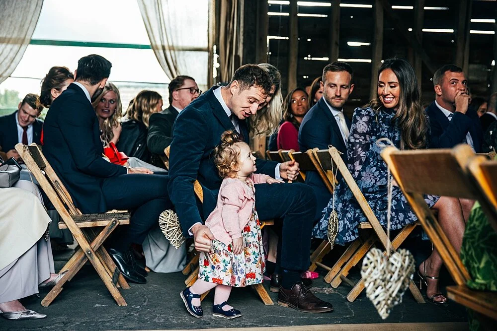 Autumn reds at The Barns at Lodge Farm with pet doggies, Irish folk music, cheesecake & budgie smugglers. Bride wears Rosa Clara & Valentino. Essex Documentary Wedding Photographer