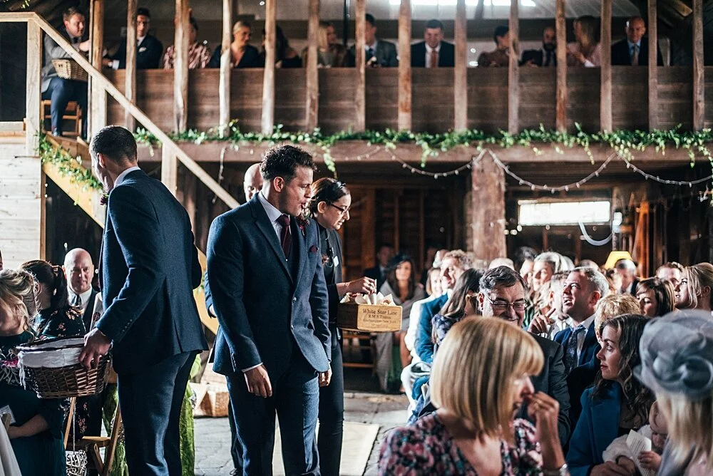 Autumn reds at The Barns at Lodge Farm with pet doggies, Irish folk music, cheesecake & budgie smugglers. Bride wears Rosa Clara & Valentino. Essex Documentary Wedding Photographer